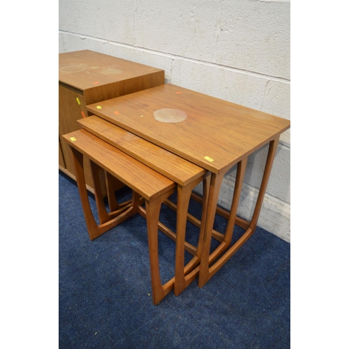 1322 - A MID 20TH CENTURY TEAK TWO DOOR RECORD CABINET together with a teak nest of three tables (sd to fin... 