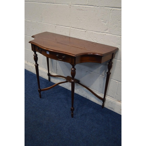 1327 - A REPRODUCTION MAHOGANY AND STRUNG SEPENTINE HALL TABLE, with concave front corners, single frieze d... 