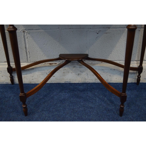 1327 - A REPRODUCTION MAHOGANY AND STRUNG SEPENTINE HALL TABLE, with concave front corners, single frieze d... 