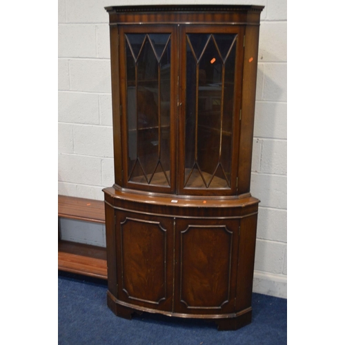 1335 - A REPRODUCTION MAHOGANY GLAZED DOUBLE DOOR CORNER CUPBOARD (key) )sd) and two mahogany cabinets (3)