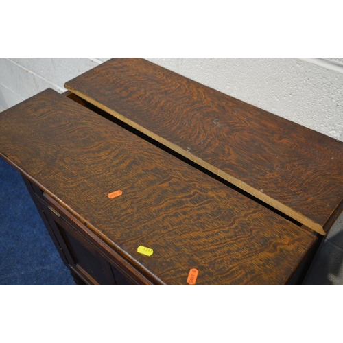 1337 - A DISTRESSED EARLY 20TH CENTURY OAK SIDEBOARD, with a raised back, double geometric panelled doors, ... 