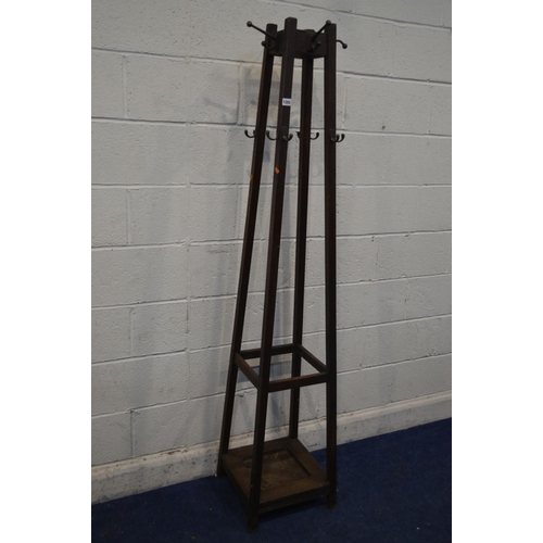 1350 - AN EARLY 20TH CENTURY ARTS AND CRAFTS OAK SQUARE TAPERING HALL STAND, with multiple brass hooks, 38c... 