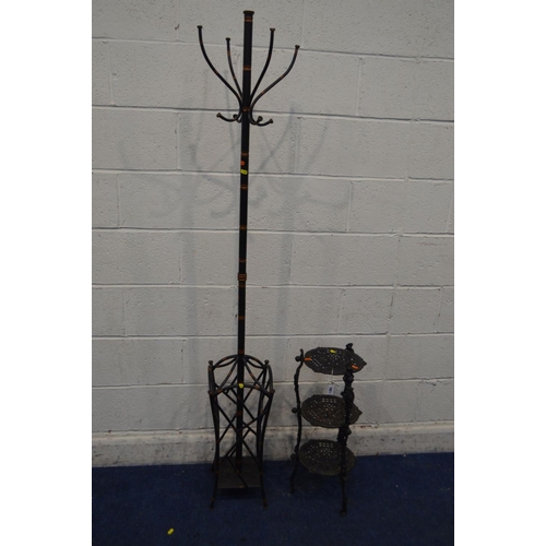 1365 - A BLACK CAST IRON THREE TIER STAND, together with a modern metal coat stand (2)