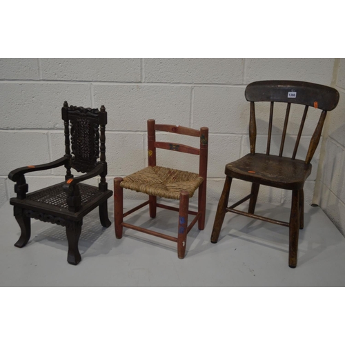 1366 - AN EARLY 20TH CENTURY OAK AND BEECH SPINDLE BACK CHILDS CHAIR, together with two other child's chair... 