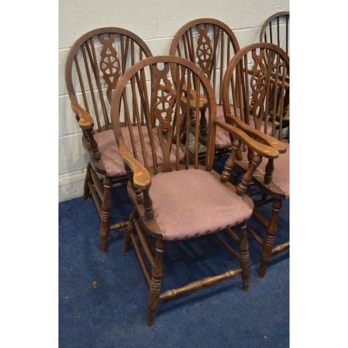 1383 - A SET OF FOUR OAK WHEELBACK OPEN ARMCHAIRS, together with another wheelback armchair and an oak hoop... 