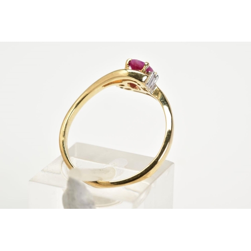 19 - A 9CT GOLD RUBY AND DIAMOND RING, the openwork crossover design, with a central claw set oval cut ru... 