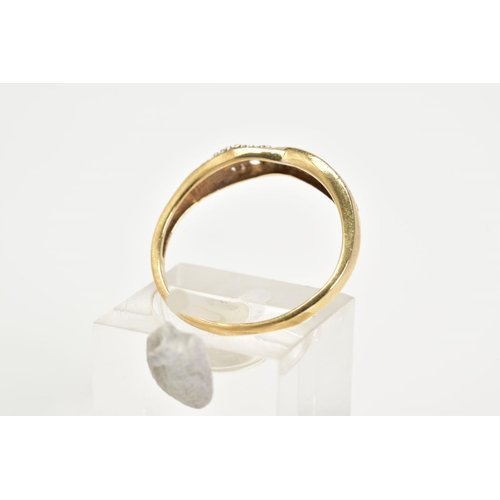 21 - A 9CT GOLD CROSSOVER RING, designed with an open work panel with the word 'I Love You' flanked with ... 