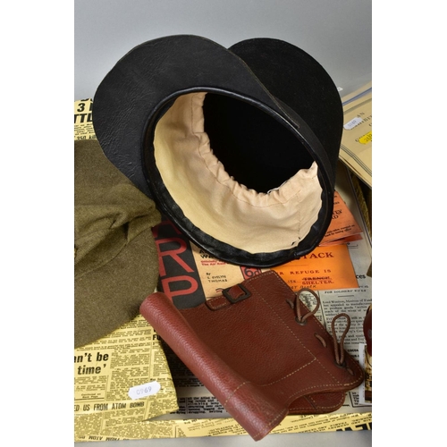 226 - A BOX CONTAINING A NUMBER OF MILITARY RELATED ITEMS to include WWII era uniform trousers and ARP cap... 