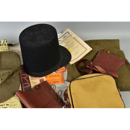 226 - A BOX CONTAINING A NUMBER OF MILITARY RELATED ITEMS to include WWII era uniform trousers and ARP cap... 