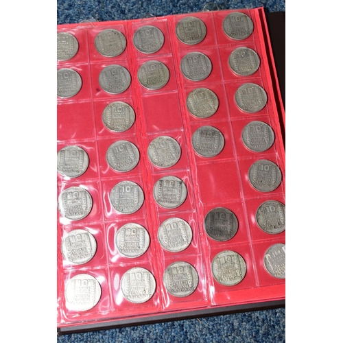 237 - TWO PLASTIC TUBS OF MAINLY FRENCH COINS, plus a banknote album, to include silver 100 Francs, 20 Fra... 