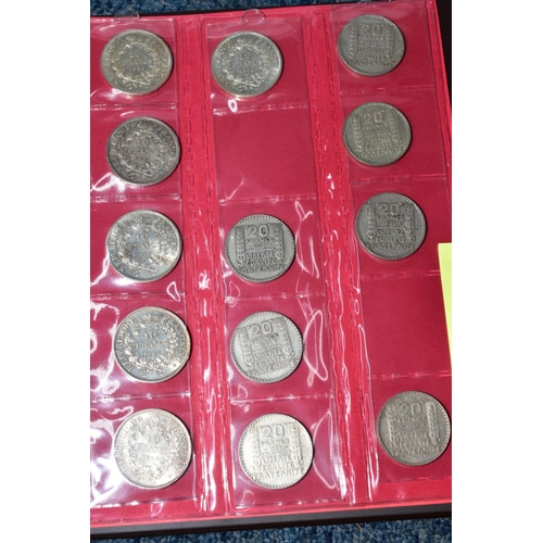 237 - TWO PLASTIC TUBS OF MAINLY FRENCH COINS, plus a banknote album, to include silver 100 Francs, 20 Fra... 