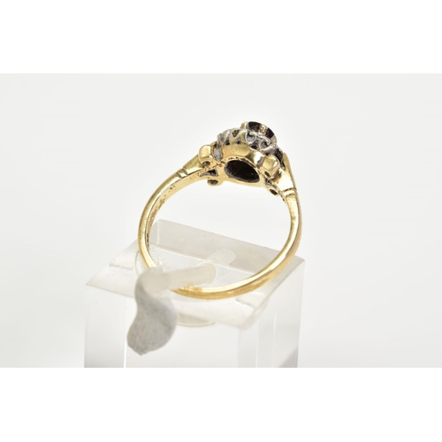 24 - A 9CT GOLD GARNET AND DIAMOND CLUSTER RING, set with a central circular cut garnet with a round bril... 