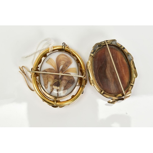 27 - TWO YELLOW METAL BROOCHES, to include a cameo swivel memorial brooch, the cameo depicting the three ... 