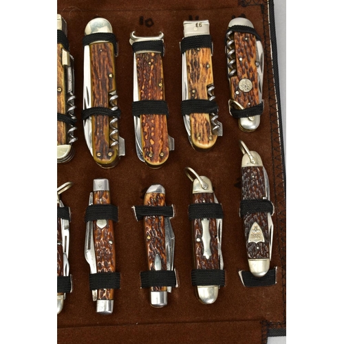 279 - A FOLD OVER CASE CONTAINING A COLLECTION OF PENKNIVES, all mounted and in good condition twenty four... 