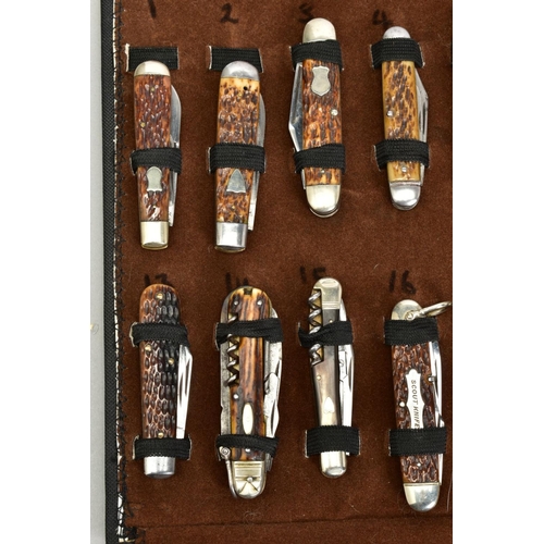 280 - A FOLD OVER CASE CONTAINING A NUMBER OF PENKNIVES, all mounted and in good condition twenty four in ... 