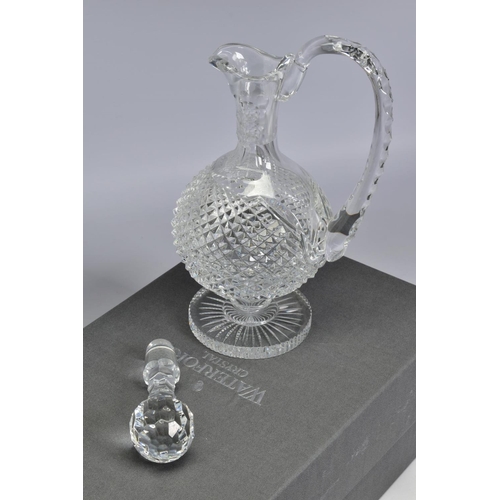 464 - A BOXED WATERFORD CRYSTAL ALANA CLARET JUG, stamped to base, height 31.5cm (crack to handle)