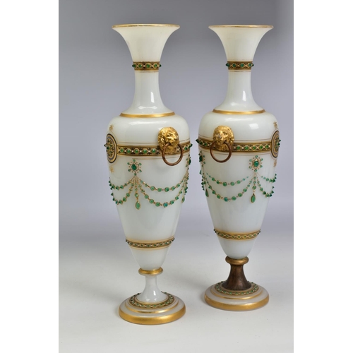 467 - A PAIR OF LATE 19TH CENTURY OPAQUE WHITE GLASS, GILT AND GREEN JEWELLED TWIN HANDLED BALUSTER VASES,... 