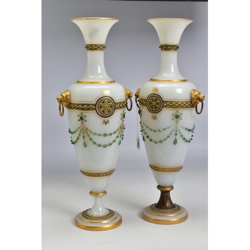 467 - A PAIR OF LATE 19TH CENTURY OPAQUE WHITE GLASS, GILT AND GREEN JEWELLED TWIN HANDLED BALUSTER VASES,... 