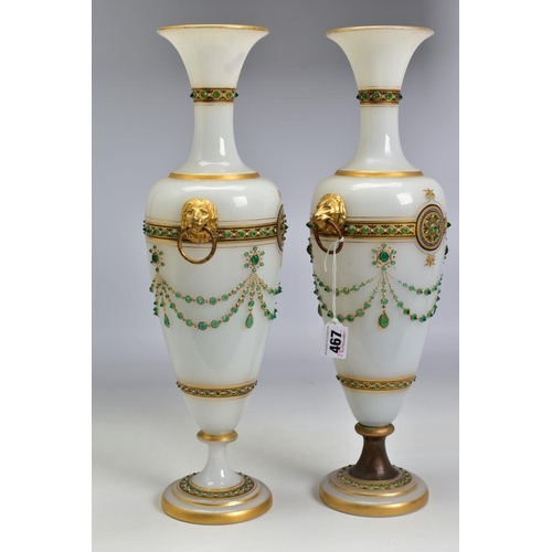 467 - A PAIR OF LATE 19TH CENTURY OPAQUE WHITE GLASS, GILT AND GREEN JEWELLED TWIN HANDLED BALUSTER VASES,... 