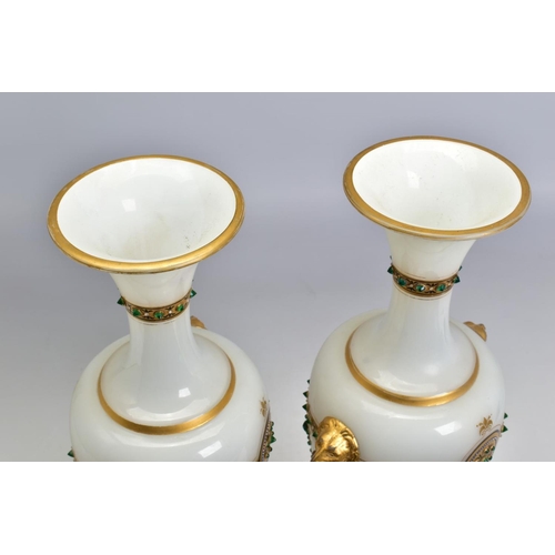 467 - A PAIR OF LATE 19TH CENTURY OPAQUE WHITE GLASS, GILT AND GREEN JEWELLED TWIN HANDLED BALUSTER VASES,... 