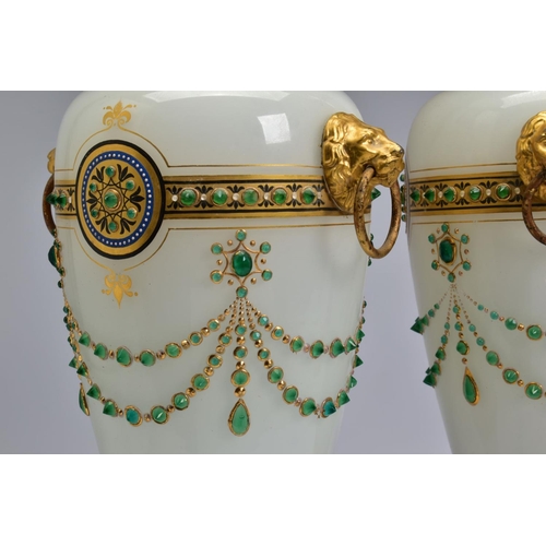 467 - A PAIR OF LATE 19TH CENTURY OPAQUE WHITE GLASS, GILT AND GREEN JEWELLED TWIN HANDLED BALUSTER VASES,... 