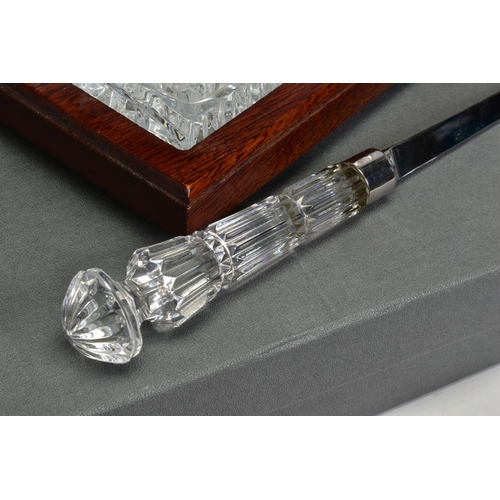 468 - A BOXED WATERFORD CRYSTAL DESK SET, comprising a quartz clock and a pen stand with pen set in a wood... 