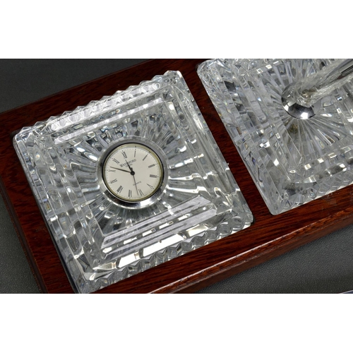 468 - A BOXED WATERFORD CRYSTAL DESK SET, comprising a quartz clock and a pen stand with pen set in a wood... 