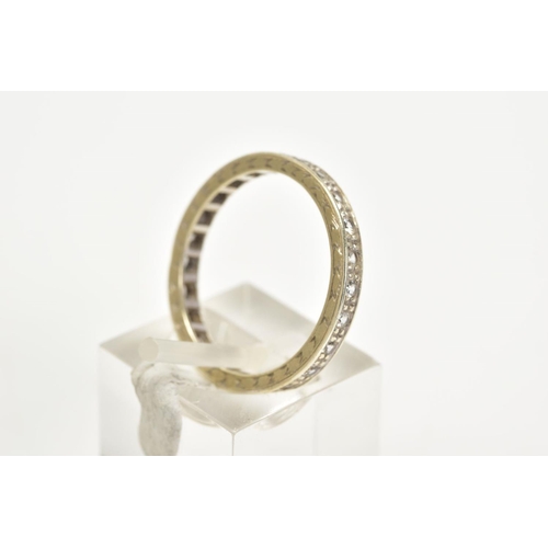 47 - A WHITE METAL GEM SET FULL ETERNITY RING, designed with claw set circular cut colourless stones, wit... 