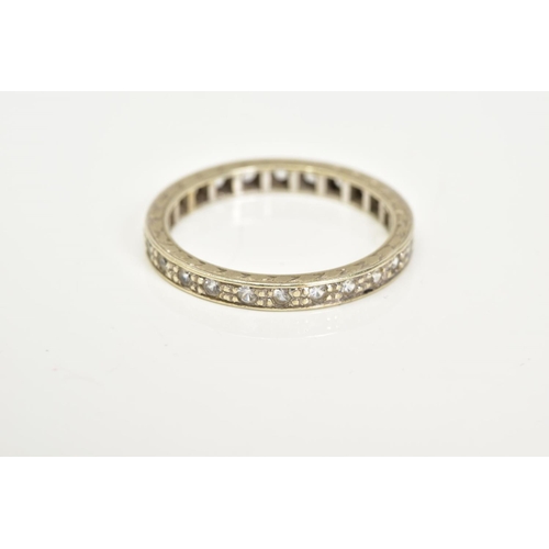 47 - A WHITE METAL GEM SET FULL ETERNITY RING, designed with claw set circular cut colourless stones, wit... 