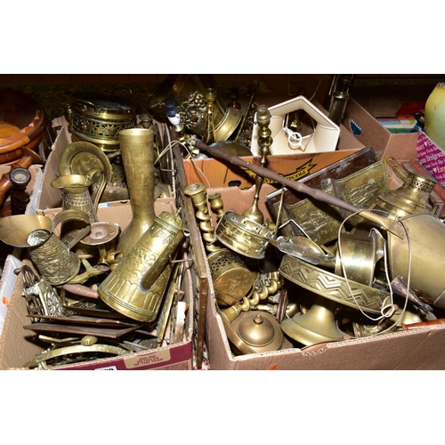 509 - FOUR BOXES OF BRASS WARES, to include candlesticks, lamp bases, trivets, jugs, bells, teapot, log ba... 