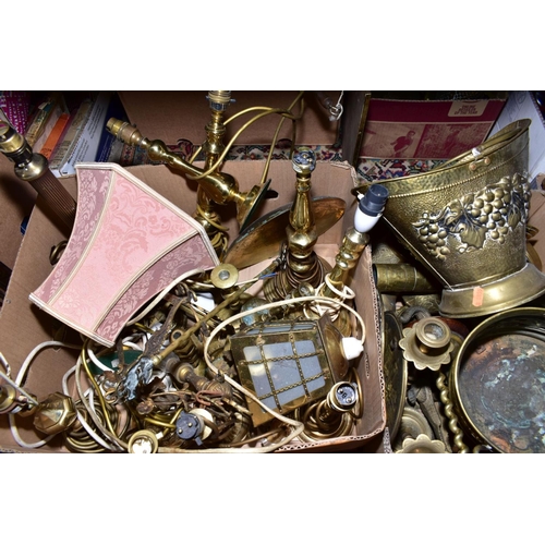 509 - FOUR BOXES OF BRASS WARES, to include candlesticks, lamp bases, trivets, jugs, bells, teapot, log ba... 