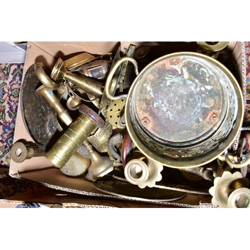 509 - FOUR BOXES OF BRASS WARES, to include candlesticks, lamp bases, trivets, jugs, bells, teapot, log ba... 