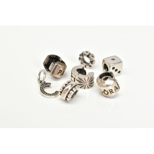 51 - A COLLECTION OF SIX PANDORA CHARMS, to include a dice, letter C initial set with colourless paste, t... 