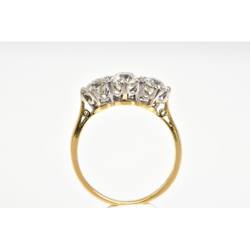 52 - A NEARLY TO MID 20TH CENTURY THREE STONE DIAMOND RING, three transitional cut diamonds, measuring fr... 