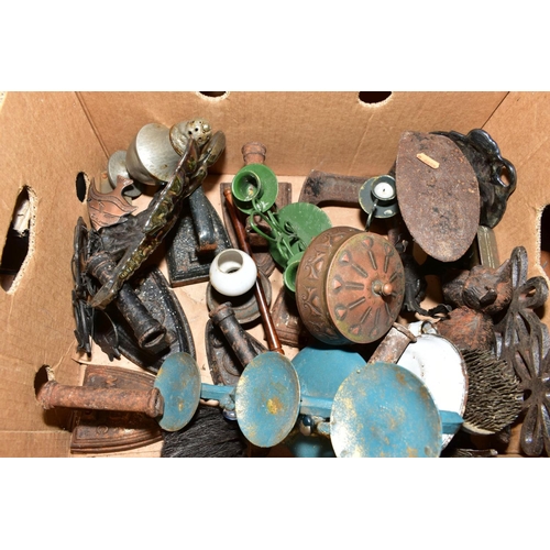 524 - TWO BOXES OF METALWARES to include a cobblers shoe last, flat irons, Scottie dog, ceiling light, can... 