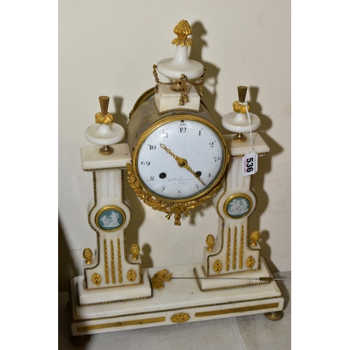 536 - A GILT AND MARBLE FRENCH CHIMING MANTLE CLOCK by A V Lacroix having Arabic numerals to a white ename... 