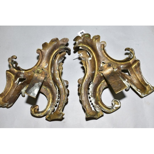 552 - A PAIR OF CAST BRASS CHERUBS ON ROCOCO SUPPORTS, possibly from a fireside fender height approximatel... 