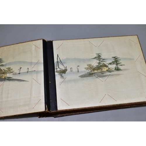 556 - A SHIBYAMA LAQUERED PHOTOGRAPH/POSTCARD ALBUM, containing 20 leaves of painted silk illustrations, t... 