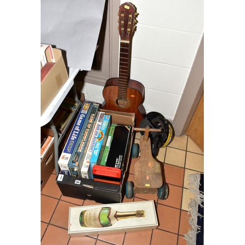 562 - AN ARIANA ACOUSTIC GUITAR, model No A572 with a quantity of boxed board games etc, to include unboxe... 