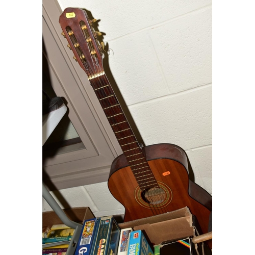 562 - AN ARIANA ACOUSTIC GUITAR, model No A572 with a quantity of boxed board games etc, to include unboxe... 