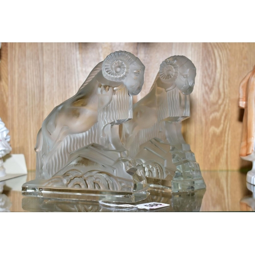 566 - A PAIR OF ART DECO FROSTED GLASS FIGURES OF RAMS, on rectangular clear glass bases, height ????, (co... 