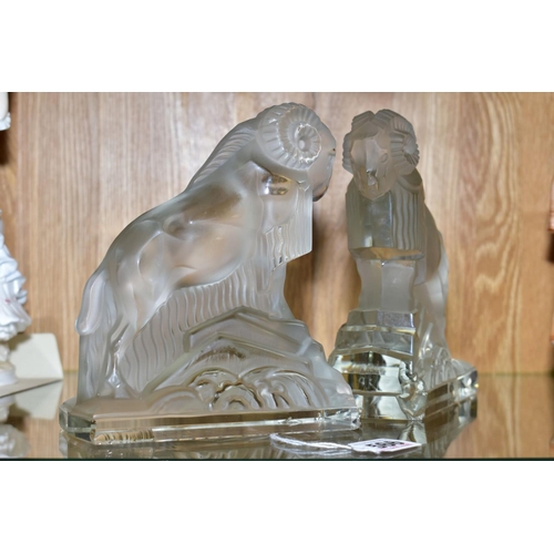 566 - A PAIR OF ART DECO FROSTED GLASS FIGURES OF RAMS, on rectangular clear glass bases, height ????, (co... 