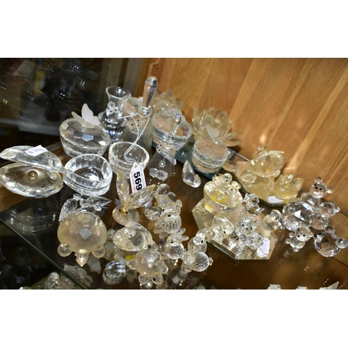 569 - A COLLECTION OF SWAROVSKI CRYSTAL BELLS, ANIMALS, TRINKET BOXES ETC, including four swans on a mirro... 