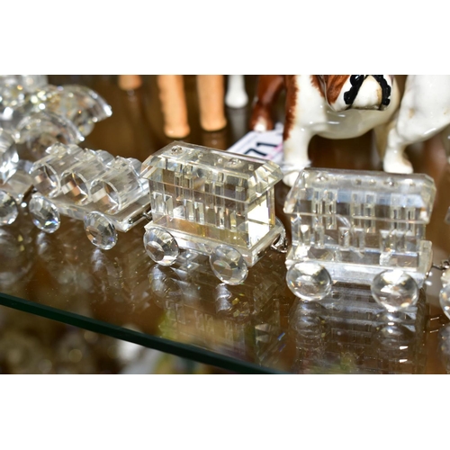 572 - A SWAROVSKI CRYSTAL TRAIN, pulling three wagons and three goods carts, length 33cm, together with se... 