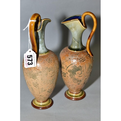 573 - A PAIR OF ROYAL DOULTON STONEWARE EWERS, blue and brown glazed handle and spout, impressed lace desi... 