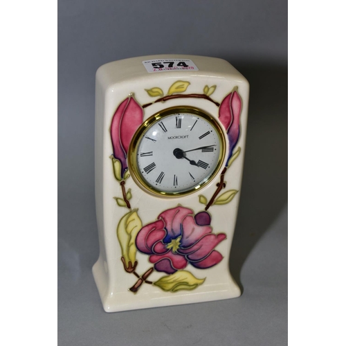 574 - A MOORCROFT POTTERY QUARTZ MANTEL CLOCK, pink magnolia design on a cream ground, impressed and paint... 