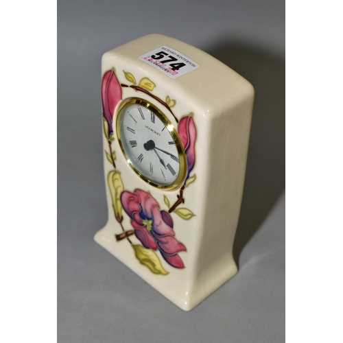 574 - A MOORCROFT POTTERY QUARTZ MANTEL CLOCK, pink magnolia design on a cream ground, impressed and paint... 