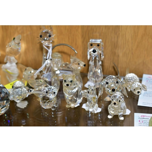 576 - A COLLECTION OF SWAROVSKI CRYSTAL DOG, CAR AND BIRD FIGURES, with a mirrored stand, including Owl, K... 