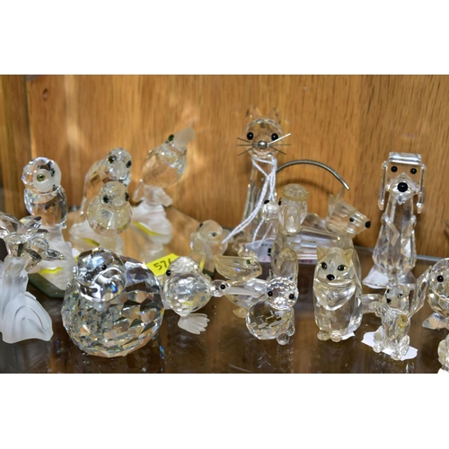 576 - A COLLECTION OF SWAROVSKI CRYSTAL DOG, CAR AND BIRD FIGURES, with a mirrored stand, including Owl, K... 