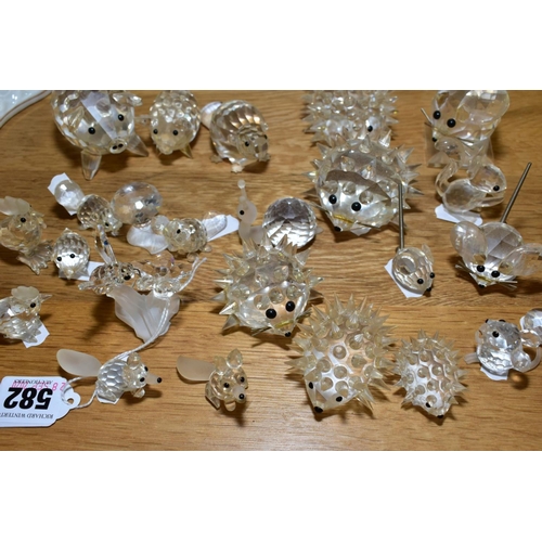 582 - A COLLECTION OF SWAROVSKI CRYSTAL ANIMALS AND BIRDS, including hedgehogs, mice, beavers, pigs, bee b... 